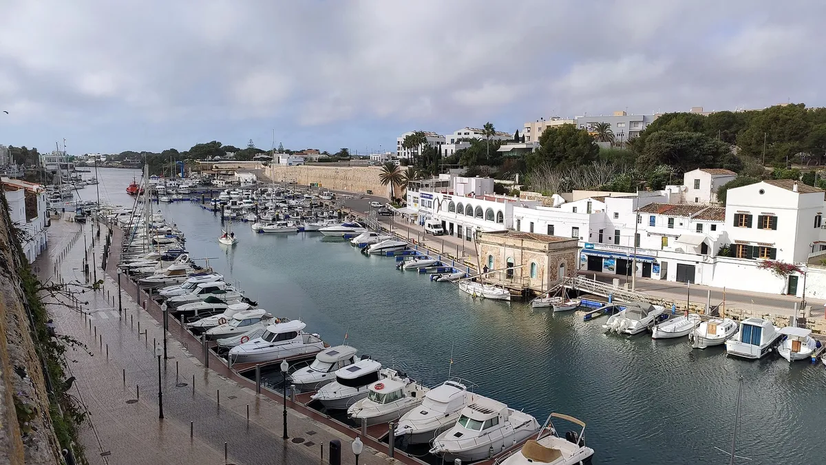 Boats moored in Ciutadella port in Menorca, the departure point for the menorca boat trips ciutadella travellers compare